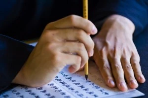 Monk calligraphing in Fo Guang Shan Buddhist monastery in Taiwan